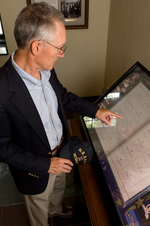 A Navy veteran accesses Golden Book digital records in the Memorial Room